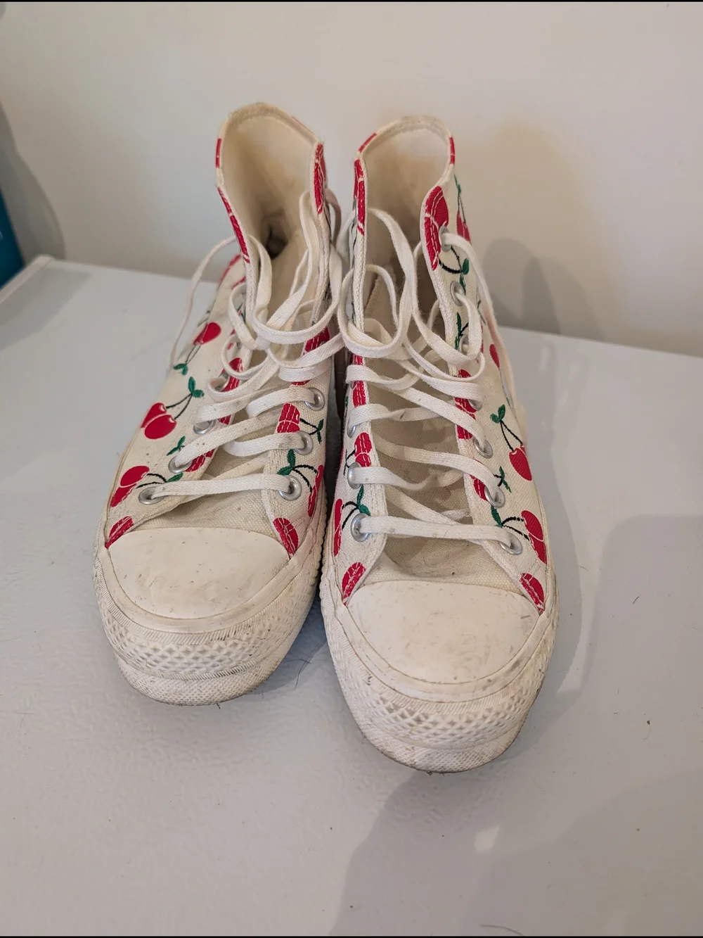 Converse Cream High-Top Sneakers with Red Cherry Accent